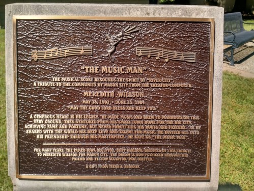 Bronze plaque honoring Meredith Willson, creator of "The Music Man," with a tribute to his contributions and friendship.