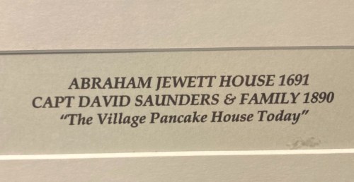 Text on a sign: "Abraham Jewett House 1691, Capt David Saunders & Family 1890, 'The Village Pancake House Today.'"