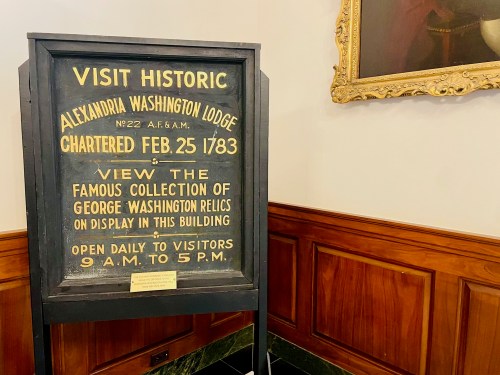 Sign promoting the Alexandria Washington Lodge, detailing its history and collection of George Washington relics.