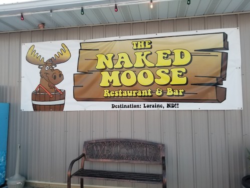 Sign for "The Naked Moose Restaurant & Bar" featuring a cartoon moose, located in Loraine, ND.