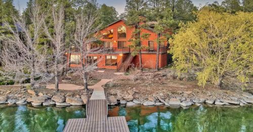 An orange luxury waterfront cabin on Rainbow Lake in Arizona