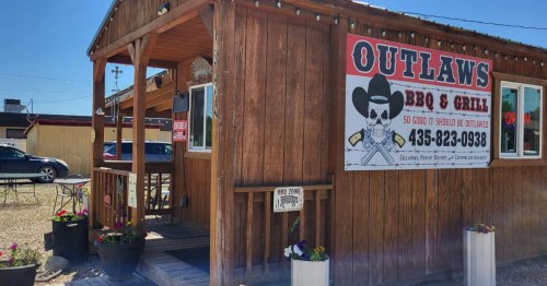A side view of Outlaw's BBQ and Grill, a rural restaurant in Duchesne, Utah.
