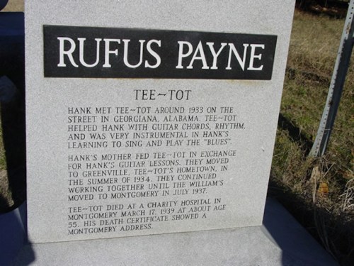 A gravestone for Rufus Payne, detailing his influence on Hank Williams and their musical connection.