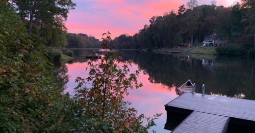a sunset over Lake Overlook in North Carolina, one of the best waterfront retreats