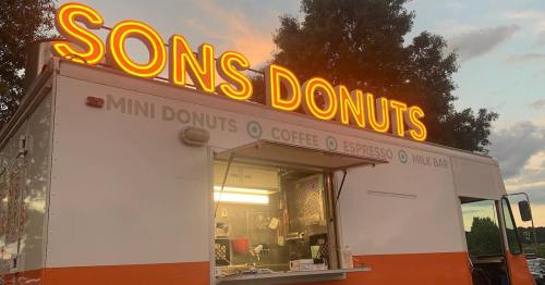 A food truck named "Sons Donuts" with a glowing sign, offering mini donuts, coffee, and espresso.