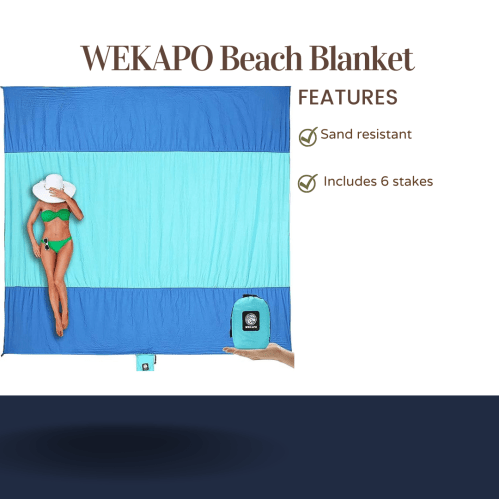 A woman in a bikini lies on a large blue and teal beach blanket, showcasing its sand-resistant features and included stakes.