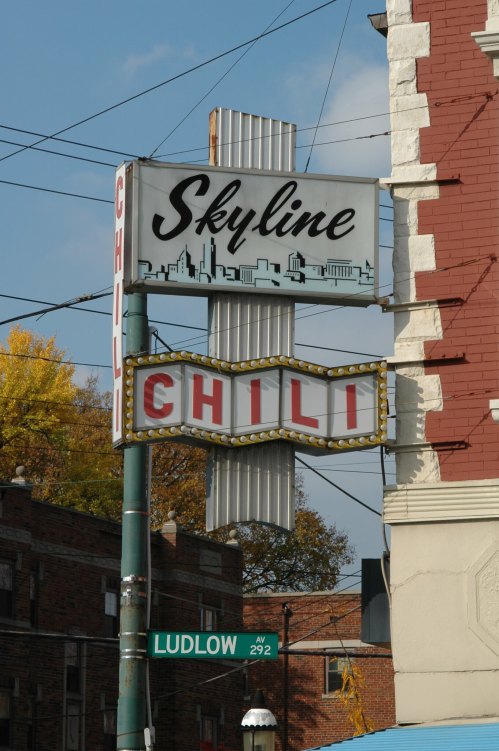 Sign for Skyline Chili with a retro design, featuring the word "CHILI" in bright lights, located at Ludlow Avenue.