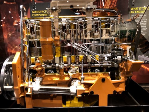 Cutaway view of a detailed engine, showcasing internal components and mechanical systems.