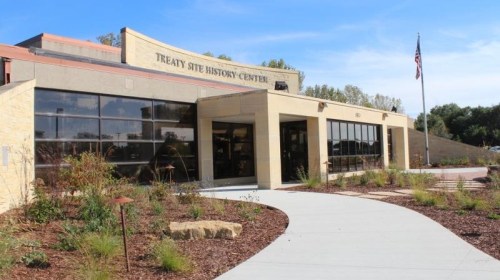 Exterior view of the Treaty Site History Center, featuring a modern building and landscaped surroundings.