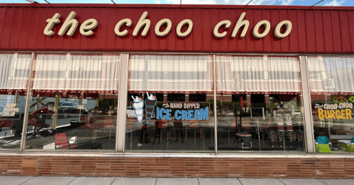 Exterior of "The Choo Choo" restaurant featuring a sign for hand-dipped ice cream and a retro-style facade.