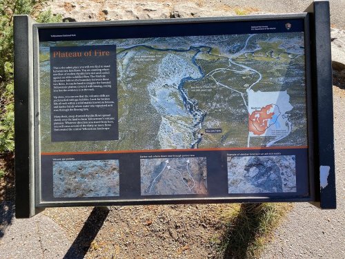 Information sign titled "Plateau of Fire" with maps and descriptions of the area's geological features and history.