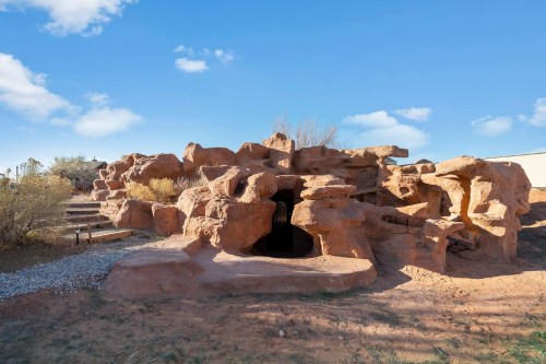 exterior of hand-carved cave in arizona
