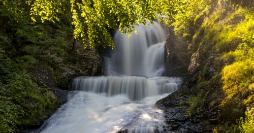 view of dingmans falls surrounded by trees in delaware
