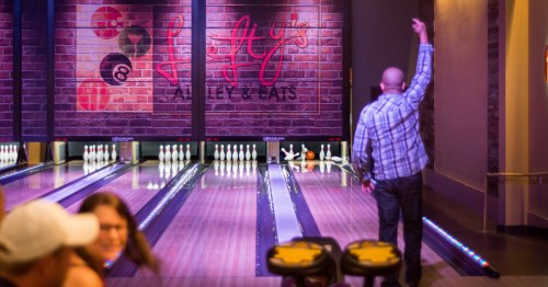 a man bowling at Lefty's Alley & Eats in delaware