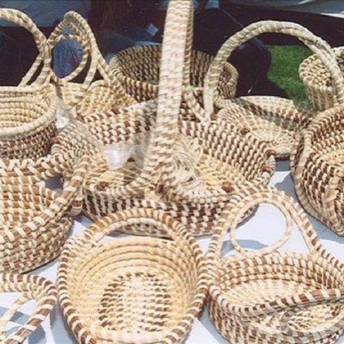 A collection of woven baskets in various sizes and shapes, displayed on a table.