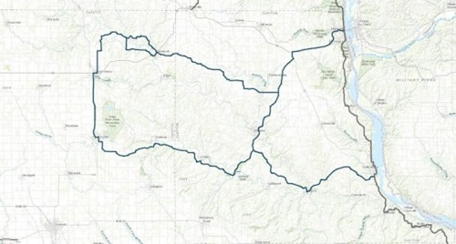 Map outline of a region, featuring topographical details and a river along the eastern edge.