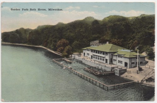 Postcard of Gordon Park Bath House in Milwaukee, featuring a lakeside building and surrounding greenery.