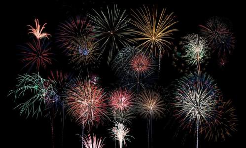 A vibrant display of colorful fireworks bursting against a dark night sky.