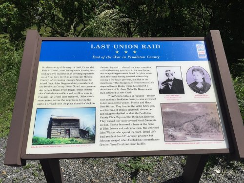 Sign detailing the Last Union Raid in Pendleton County, featuring historical images and text about the event.