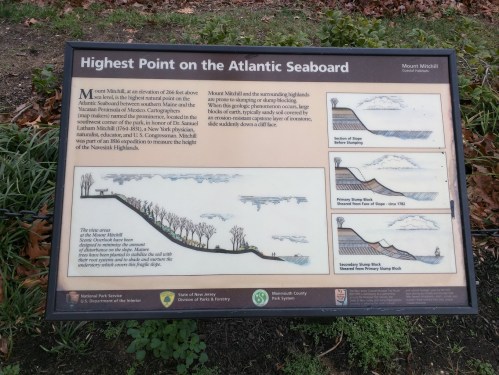 Sign detailing the highest point on the Atlantic Seaboard, featuring historical information and illustrations of the landscape.