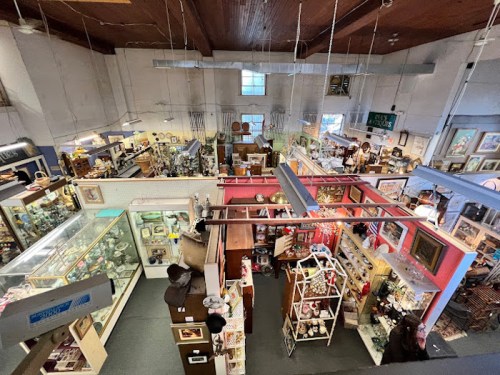 Aerial view of a bustling antique shop filled with various collectibles, art, and vintage items.