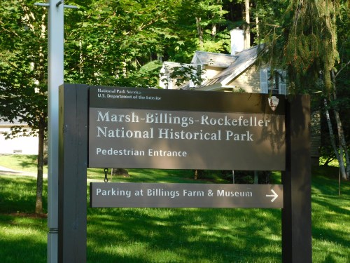 Sign for Marsh-Billings-Rockefeller National Historical Park, indicating pedestrian entrance and parking directions.