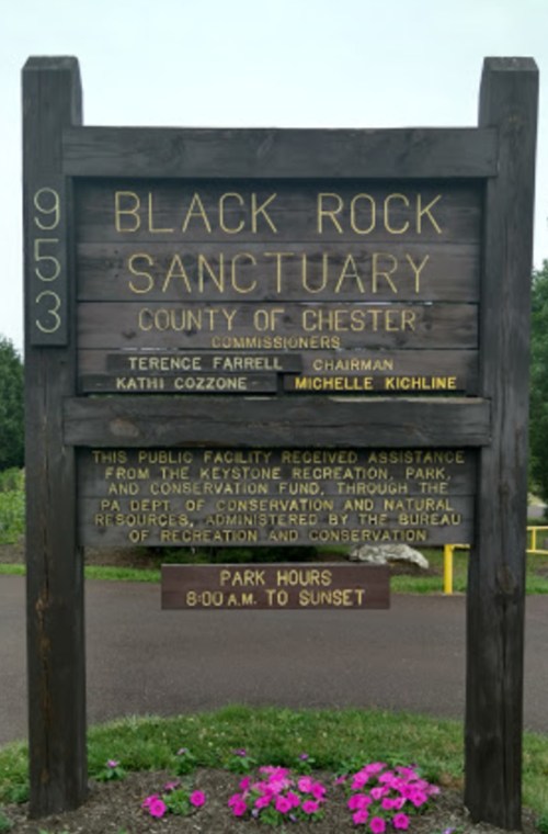 Sign for Black Rock Sanctuary in Chester County, listing commissioners and park hours from 8:00 AM to sunset.