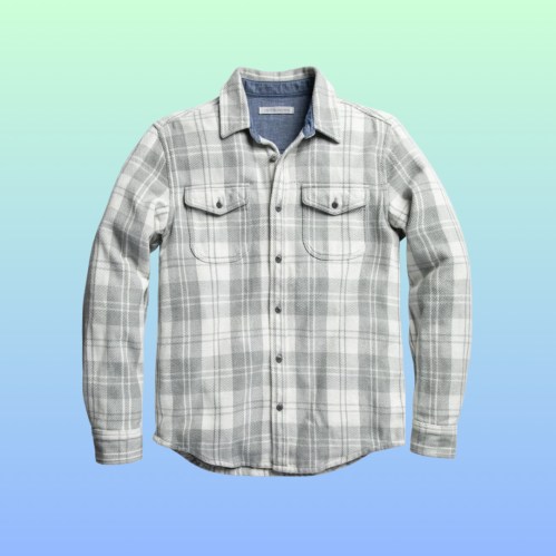 Gray and white plaid flannel shirt with two chest pockets, displayed against a gradient background.