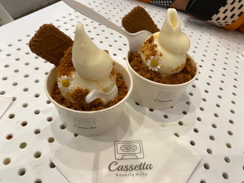 Two cups of soft serve ice cream topped with crushed cookies and a cookie garnish, served at Cassetta, Beverly Hills.