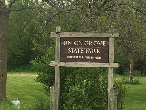 Sign for Union Grove State Park, surrounded by greenery, indicating the Department of Natural Resources.