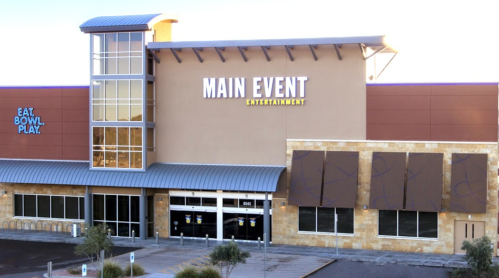 Exterior view of Main Event Entertainment building with a modern design and large windows.
