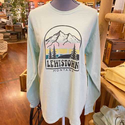 Light blue long-sleeve shirt featuring a graphic of mountains and trees with "Lewistown Montana" text.