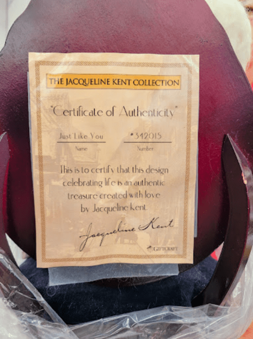 A certificate of authenticity for a design by Jacqueline Kent, titled "Just Like You," with a unique number.