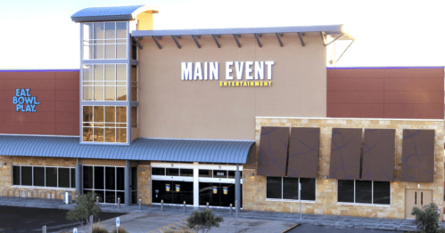 Exterior view of a Main Event Entertainment center, featuring a modern design and large signage.