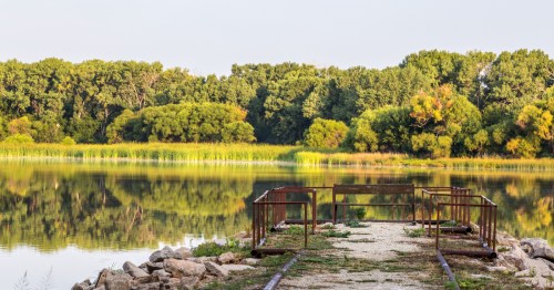 view of the kingman state fishing lake and a pier in kansas