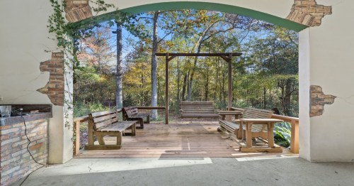 outdoor patio photo with benches and trees