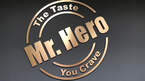 Logo of Mr. Hero featuring the text "The Taste You Crave" in a circular design on a dark background.