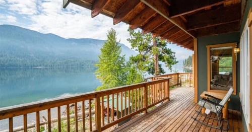views of Lake Wenatchee and mountains across the lake from a large deck of an airbnb in leavenworth washington