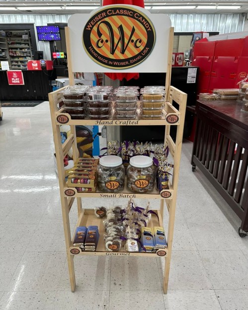Display stand featuring various handcrafted candies, jars, and gourmet treats from Weser, Idaho.