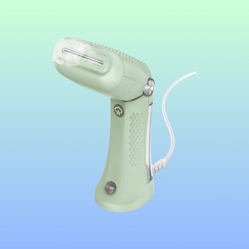A mint green handheld steamer releasing steam against a gradient background.