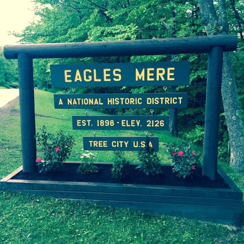 Sign for Eagles Mere, a National Historic District established in 1898, located in Tree City, U.S.A. Elevation 2126 feet.