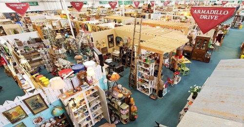 Aerial view of a large antique store filled with various items, including furniture, decor, and collectibles.