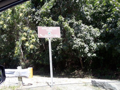 Sign for the Appalachian Trail surrounded by greenery, indicating the trail's location.