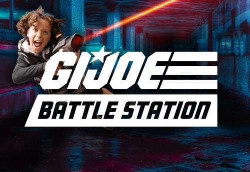 A child joyfully poses with a toy gun, set against a colorful, futuristic background with "G.I. Joe Battle Station" text.