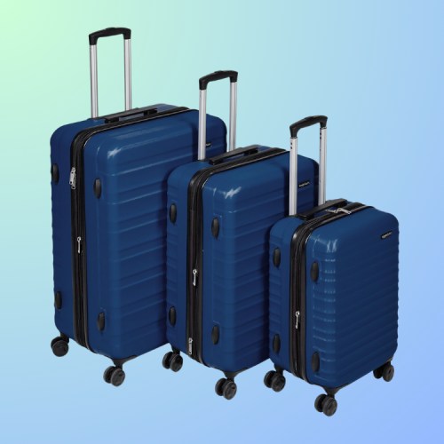 Three blue suitcases of varying sizes on a gradient background, featuring wheels and extendable handles.
