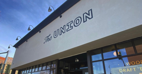 Exterior of a building with the sign "The UNION" prominently displayed above large windows.