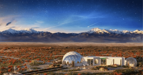 A futuristic dome structure in a desert landscape, with mountains and a starry sky in the background.