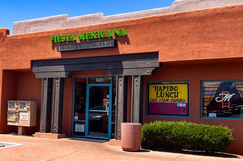 Exterior of Fiesta Mexicana Family Restaurant, featuring a colorful sign and a menu board advertising a lunch special.