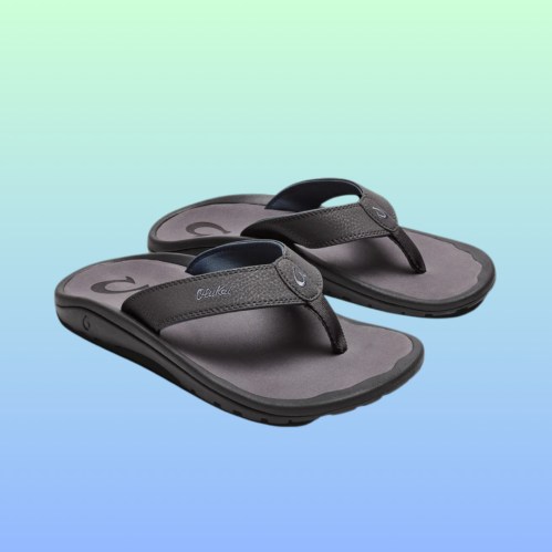 A pair of gray flip-flops on a gradient background, featuring a simple design and cushioned soles.