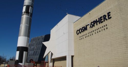 the exterior of Cosmosphere, the Kansas Space Center, with a rocket next to it, in Hutchinson